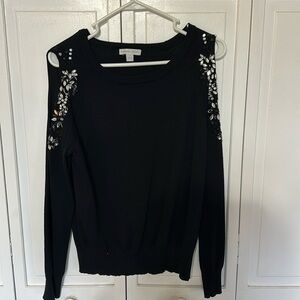 Women’s black sweater embellished with rhinestones